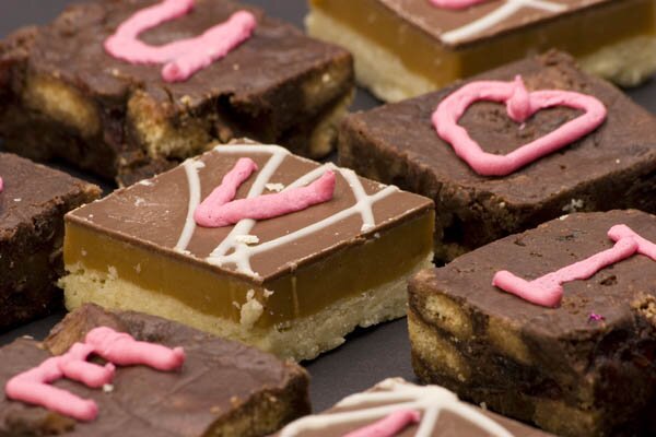 i-love-you-chocolate-©-Martin-Garnham-Dreamstime1.com_.jpg Chocolate cakes with 'love hearts' written in icing.